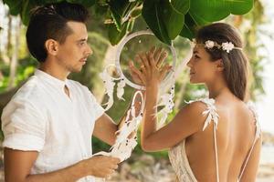 Just married couple is celebrating their wedding on the beach photo