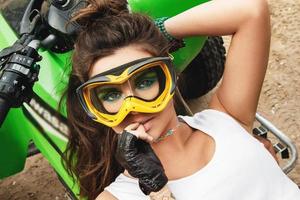 Stylish and beautiful woman and the ATV photo