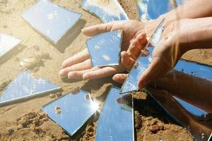 Mirror shards and female hands photo