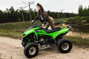 Stylish and beautiful woman and the ATV photo