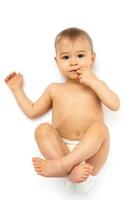 Cute little baby in diaper on white background photo