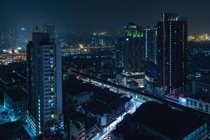 Scenic view of Modern Bangkok city at night photo