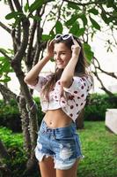 Beautiful young woman is wearing shirt with polka dot print photo