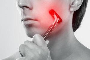 Man with a sensitive skin during a shaving routine photo