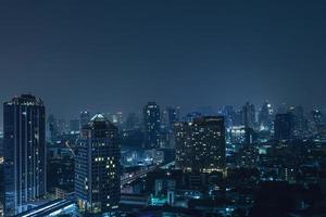 Scenic view of Modern Bangkok city at night photo