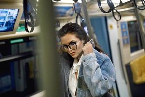 Sexy model is posing in carriage of metro train photo