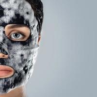 Woman with bubble sheet mask on her face photo