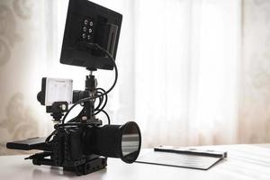 Modern mirrorless camera rig and clapperboard photo