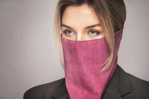 Woman wearing stylish leather bandana instead of prevention mask. photo