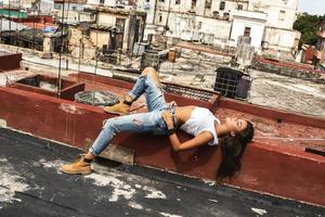 Woman on the roof of old building in Havana photo