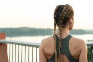 Woman athlete during her outdoor fitness workout photo