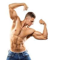 Handsome and muscular guy on white background photo