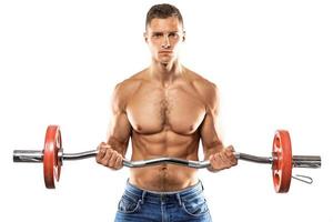 Young muscular man doing bicep barbell curl exercise photo