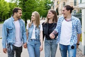 Group of best friends are having fun in a city park photo