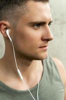 Portrait of a handsome man with an earphones. photo