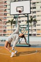 Young stylish woman is posing on the Choi Hung Estate Basketball Court photo