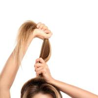 Woman is holding her healthy and long hair photo
