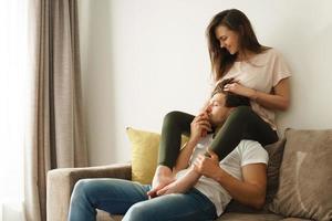 Young and lovely couple relaxing at home photo