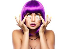 Model in creative image with pop art makeup photo