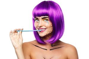 Model in creative image with pop art makeup photo