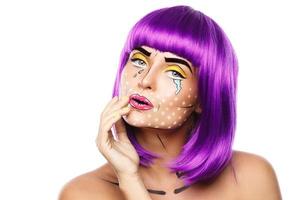 Model in creative image with pop art makeup photo