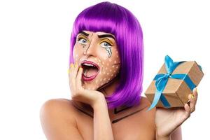 Model in creative image with pop art makeup photo