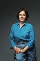 Beautiful middle aged woman wearing blue shirt photo