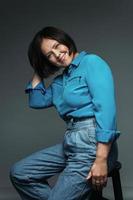 Beautiful middle aged woman wearing blue shirt photo