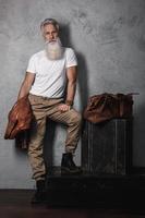 Handsome bearded senior man posing in studio photo