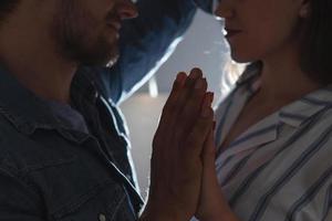 Portrait of young loving couple at kitchen photo