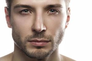 Young and handsome man on white background photo