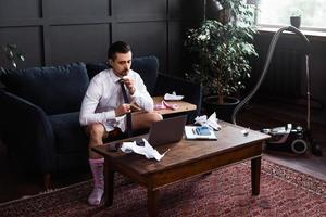 Businessman without pants during job interview or online meeting during distant work from home photo