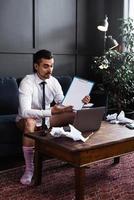 Businessman without pants working from home. Concept of distant work during quarantine photo