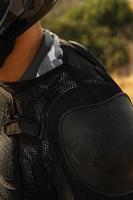 Closeup of professional MTB rider body armour for downhill photo