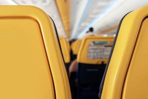 Close up view of seats inside an airplane photo