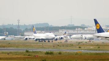 FRANKFURT AM MAIN, GERMANY JULY 17, 2017 - Long shot of a Lufthansa Boeing 747 on the runway at Frankfurt International Airport, Germany FRA video