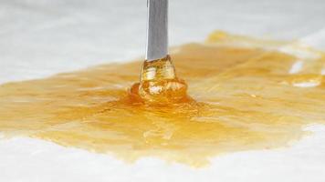 fragrant golden terp sauce for smoking cannabis, wax weed with thc content photo