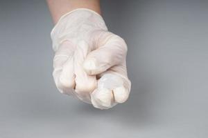 urologist appointment concept, lubricant on the fingers of a doctor in gloves,massage prostate photo