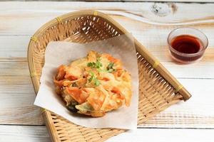 Kakiage Tempura Shrimp, Vegetable, and Sweet Potato  on Bamboo Plate photo