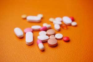 Close up of many colorful pills and capsules photo