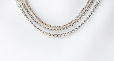 Group of gold and silver chain necklace isolated background photo