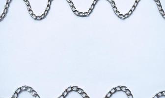 Wavy silver chain frame for copy space and background photo