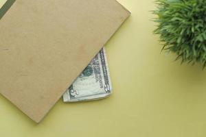 close up of one dollar cash in a notepad photo