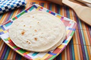 homemade roti chapati on table . photo