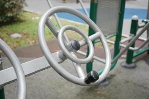 Outdoor fitness machines in a park in singapore photo