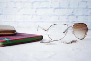 broken eye glass on table with copy space photo