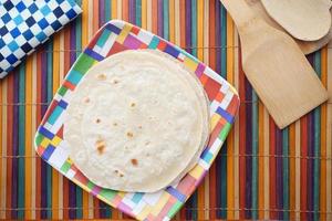 homemade roti chapati on table . photo