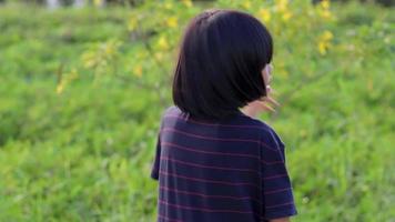 Close-up of the face of an elementary school girl, child girl, slow motion video