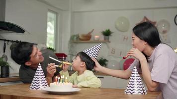 Father mother and Son blowing toys to make happy birthday. Family activities and happy birthday party. Parent activities to strengthen relationships within the family video