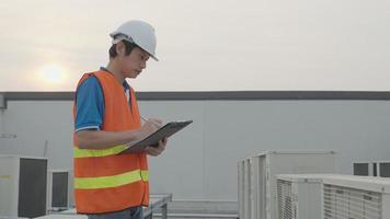 engineers checking the cooling system of the factory on evening. VDO slow-motion about Utility engineer, maintenance engineer, factory engineer. video